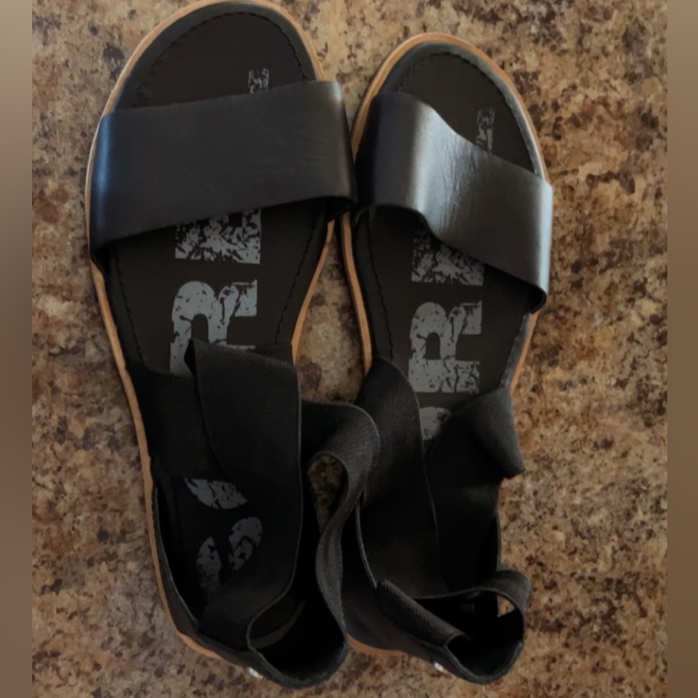 Black brand new Sorel sandals. Never worn, too big for me.
